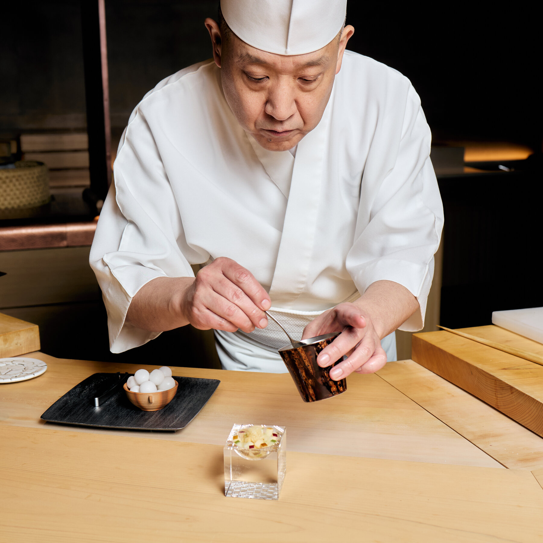 Restaurant interior or chef preparing sushi